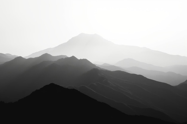 Tranquil black and white image highlighting the minimalist beauty of layered mountain silhouettes