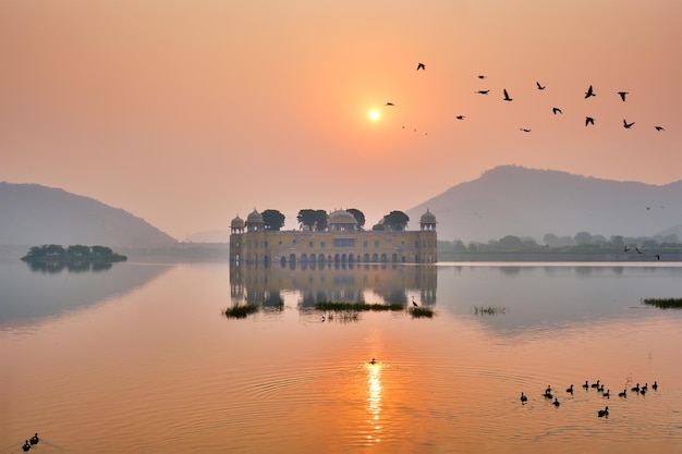 Tranquil morning at jal mahal water palace at sunrise in jaipur rajasthan india