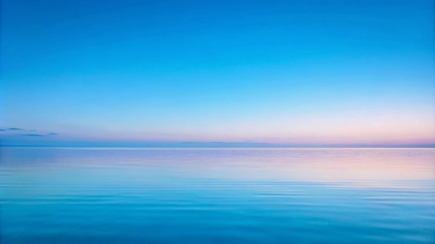 Photo tranquil seascape with a blue sky and calm water at dawn