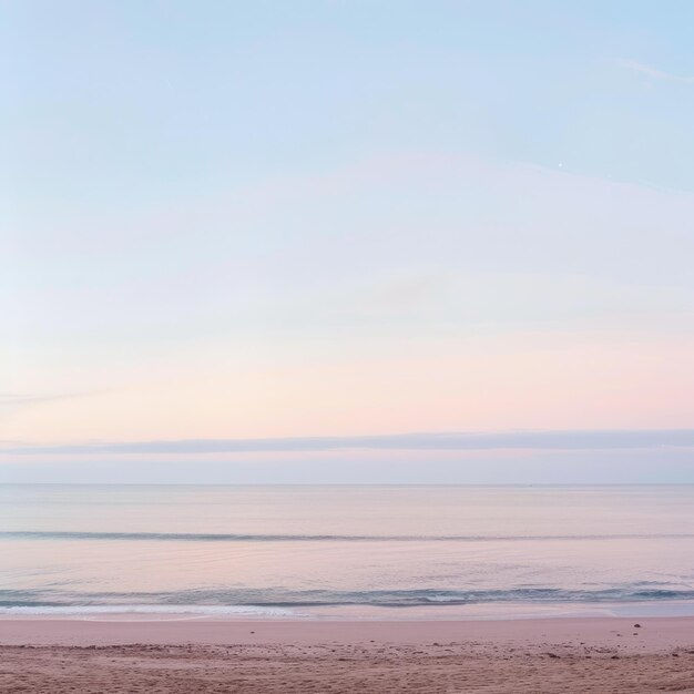 Photo tranquil seascape with a soft pastel sky and gentle waves on a sandy beach