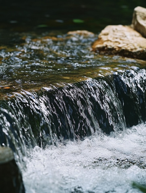 Photo tranquil waterfall flowing over rocks in nature