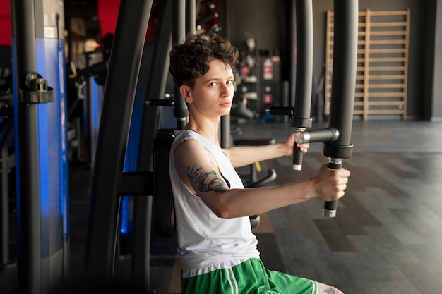 Trans man exercising at the gym