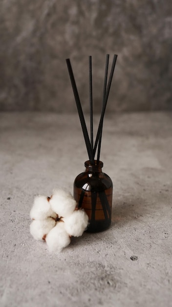 Transparent bottle of aroma diffuser Parfum for home with cotton flowers