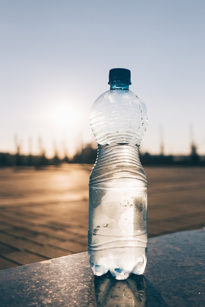 Transparent bottle with cold drinking water