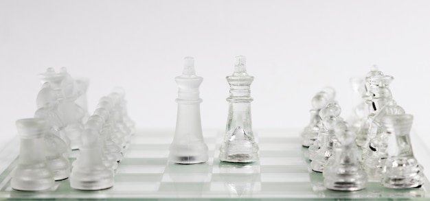 Transparent chess pieces on board