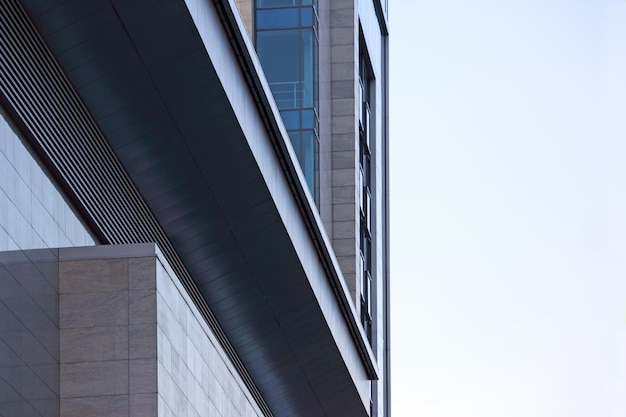 Transparent facade of the building against the sky