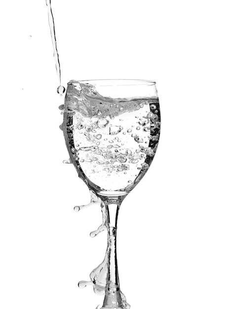 transparent glass glass with water splashes isolated on a white background