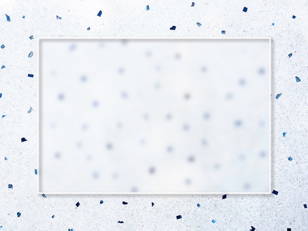 A transparent glass square border frame on white floor with many blue pieces of stones texture surface background top view