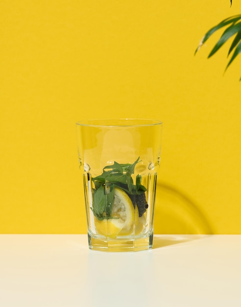 Transparent glass with ingredients for lemonade