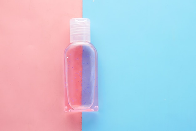 Transparent hand sanitize on color background