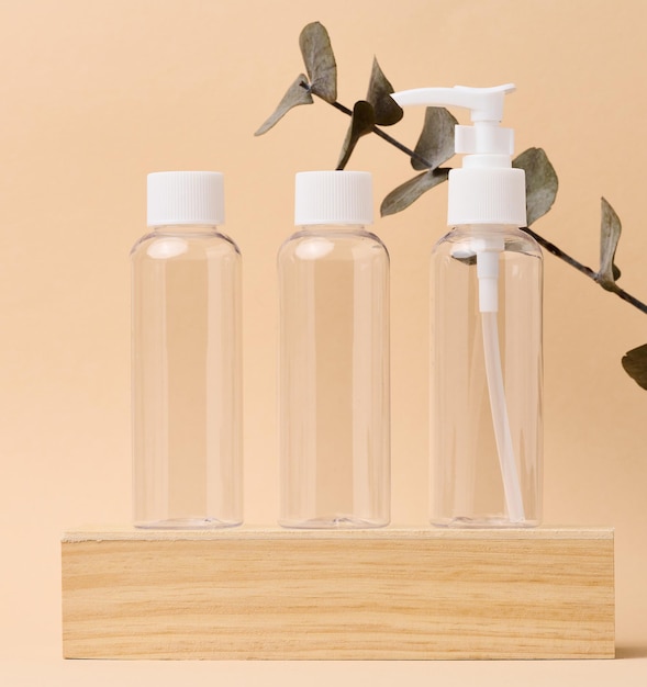 Transparent plastic container for cosmetics on the table bottles for liquid cosmetics