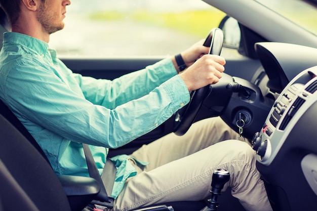 Photo transport, business trip, destination and people concept - close up of young man driving car