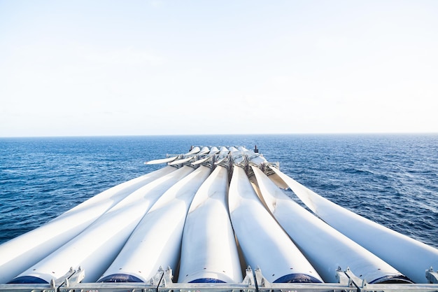 Transportation of blades for wind turbines on a cargo ship across the ocean