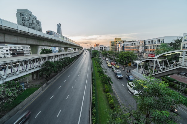 Transportation Railroad station with traffic jam and elevated train metro system in rush hour 