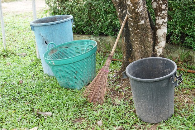 Trash and brooms were left under the shade 
