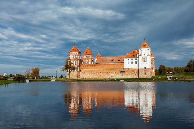 Travel belarus background Medieval Mir castle famous landmark in town Mir Belarus reflecting in lake