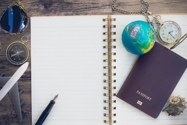 Travel Blogger accessories on wood copy space