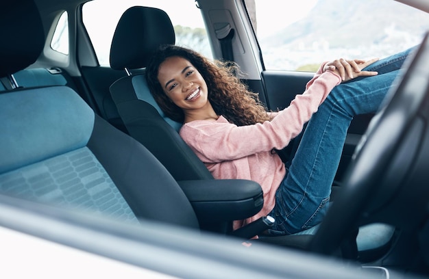 Travel car passenger and black woman relax on road trip for fun journey peace or open road freedom Happy smile and portrait of gen z girl in SUV van for transportation adventure in San Francisco