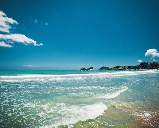 Travel concept - beach with clouds and blue sky