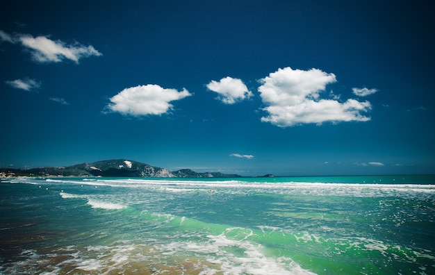 Travel concept - beach with clouds and blue sky