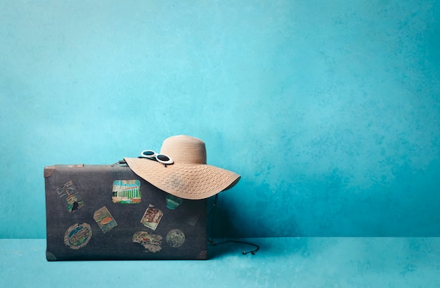 Travel luggage and straw hat