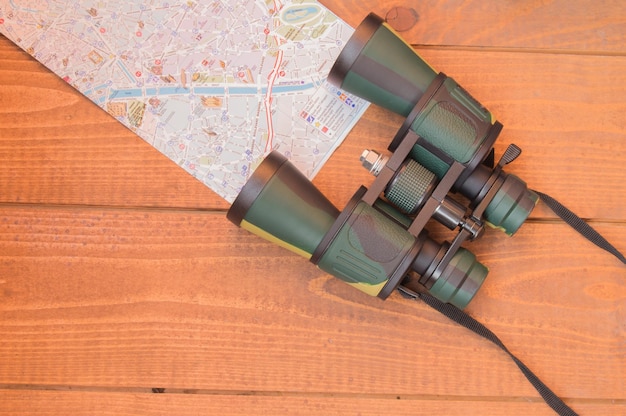 Travel planning vacation tourism binoculars and a map