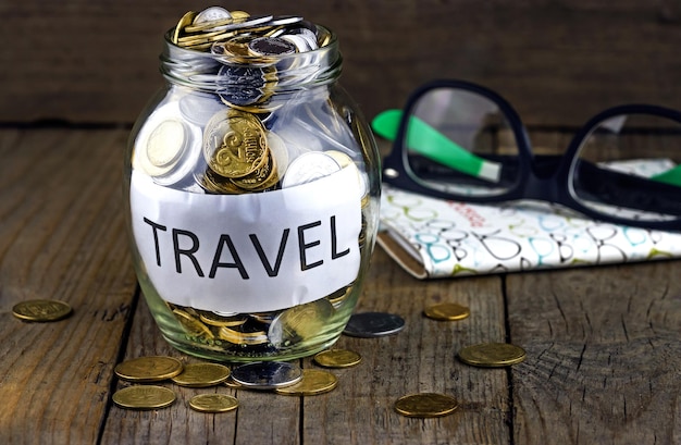 Travel savings bank with coins