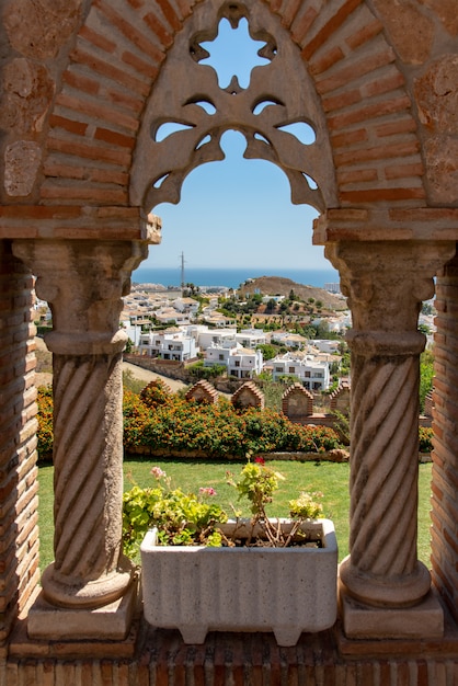 Travel sightseeing in Spain looking through castle window