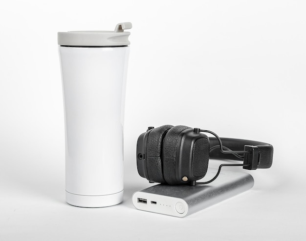 Travel stuff thermo mug portable charger headphones