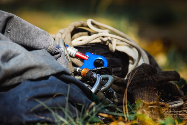 Travel supplies lie on the light green grass.