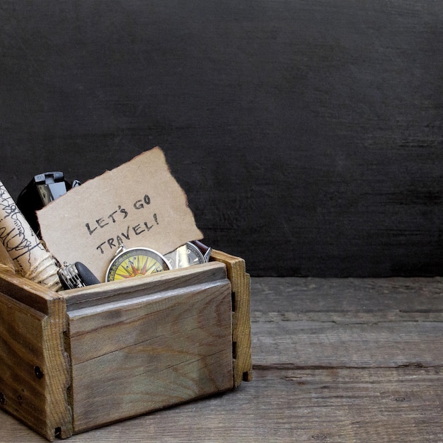 Travel and vacation, wooden box table background, compass, map