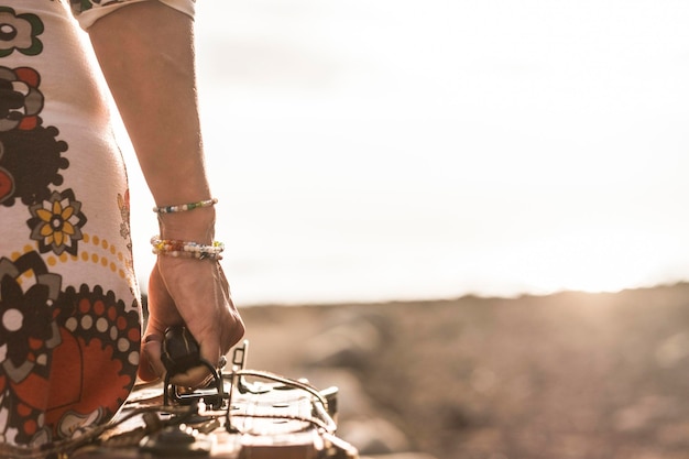 Travel and wanderlust concept for nice woman legs and old vintage luggage colored dress and beautiful legs sexy and conceptual image traveler female alone looking for destination