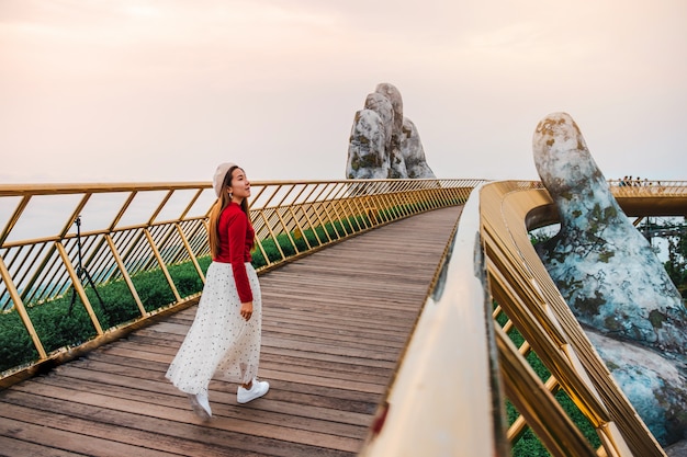 Travel woman at Golden Bridge in Ba Na Hills ,Danang Vietnam