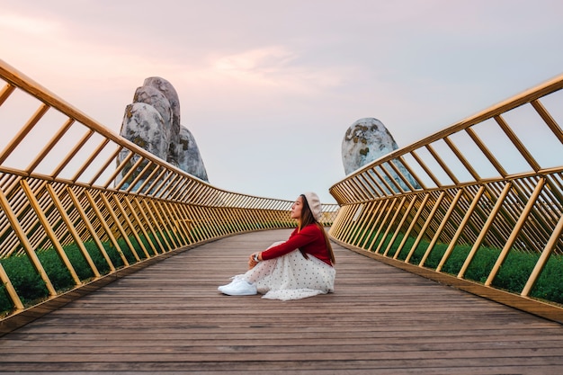 Travel woman at Golden Bridge in Ba Na Hills ,Danang Vietnam