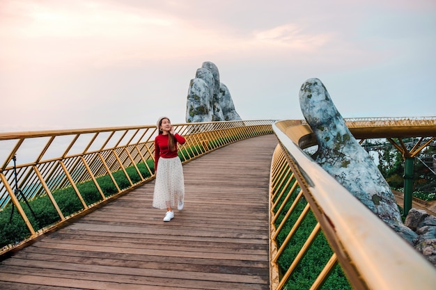 Travel woman at Golden Bridge in Ba Na Hills, Danang Vietnam