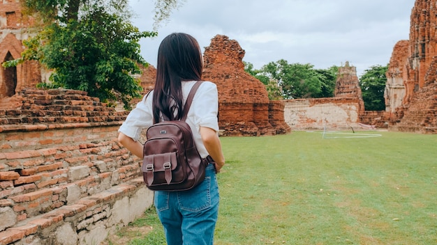 Traveler Asian woman spending holiday trip at Ayutthaya, Thailand