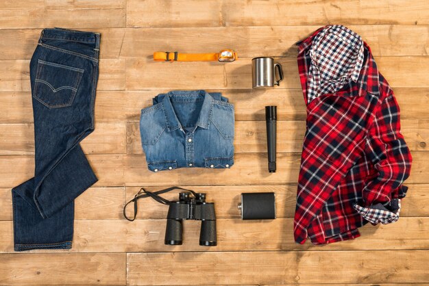 Traveler set on wooden background flat lay