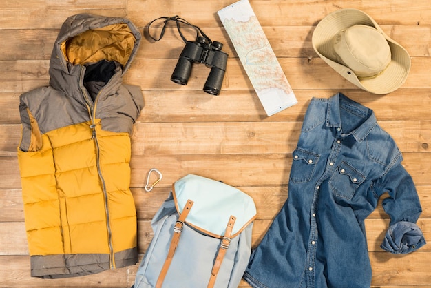 Traveler set on wooden background flat lay