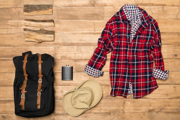 Traveler set on wooden background flat lay