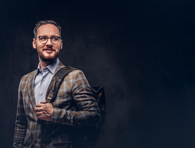 Traveler. Studio portrait of a handsome bearded man wearing a ca