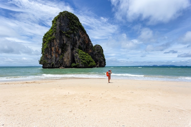 Photo traveler take a photo at railay beach in sunshine day