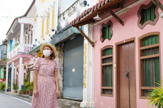 Travelers on street Phuket old town with Building Sino Portuguese architecture at Phuket Old Town area Phuket, Thailand. Travel concept