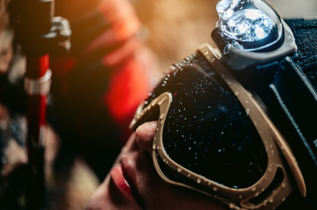 Travelers wearing glasses with a flashlight on their heads illuminate the way they are climbing