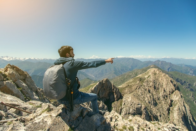 Traveling young man show in the mountain