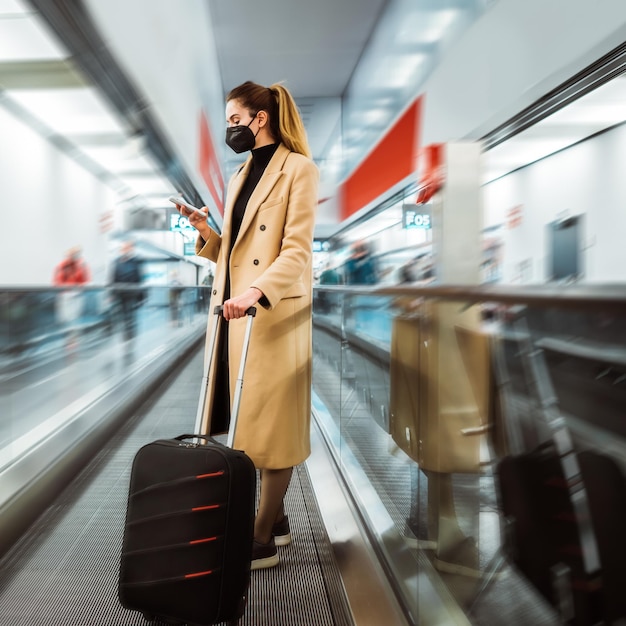 Traveller at the airport Traveling during covid19 Vertical image