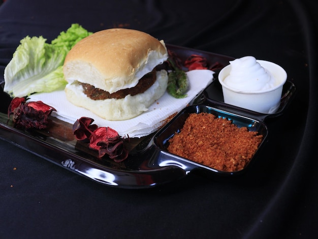 a tray of food with a sandwich and a salad