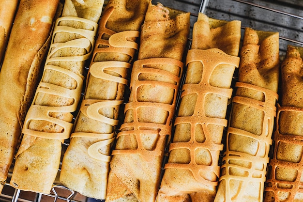 A tray of pancakes with peanut butter on top