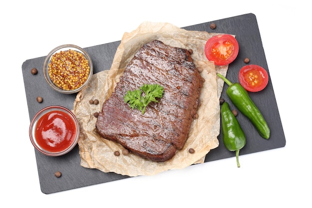 Tray with beef steak and ingredients isolated on white background