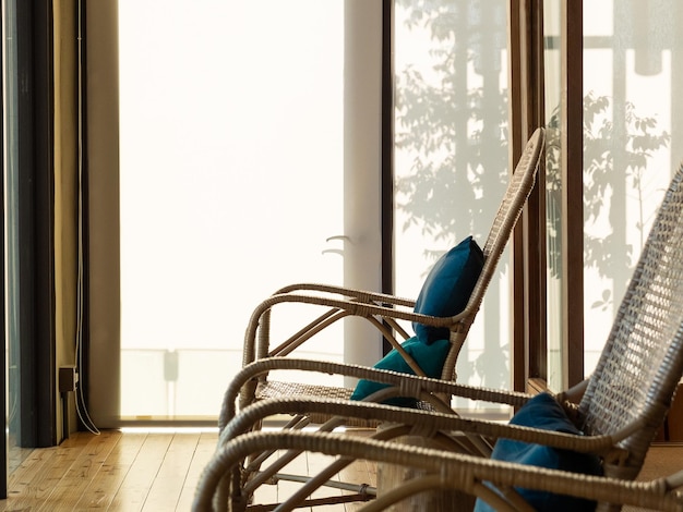 tree shadow on curtain and rattan chairs