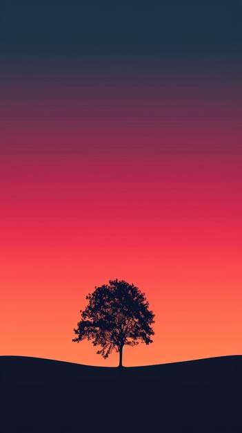 Photo tree silhouette stands against gradient sunset sky